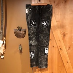 Distressed moto jeans